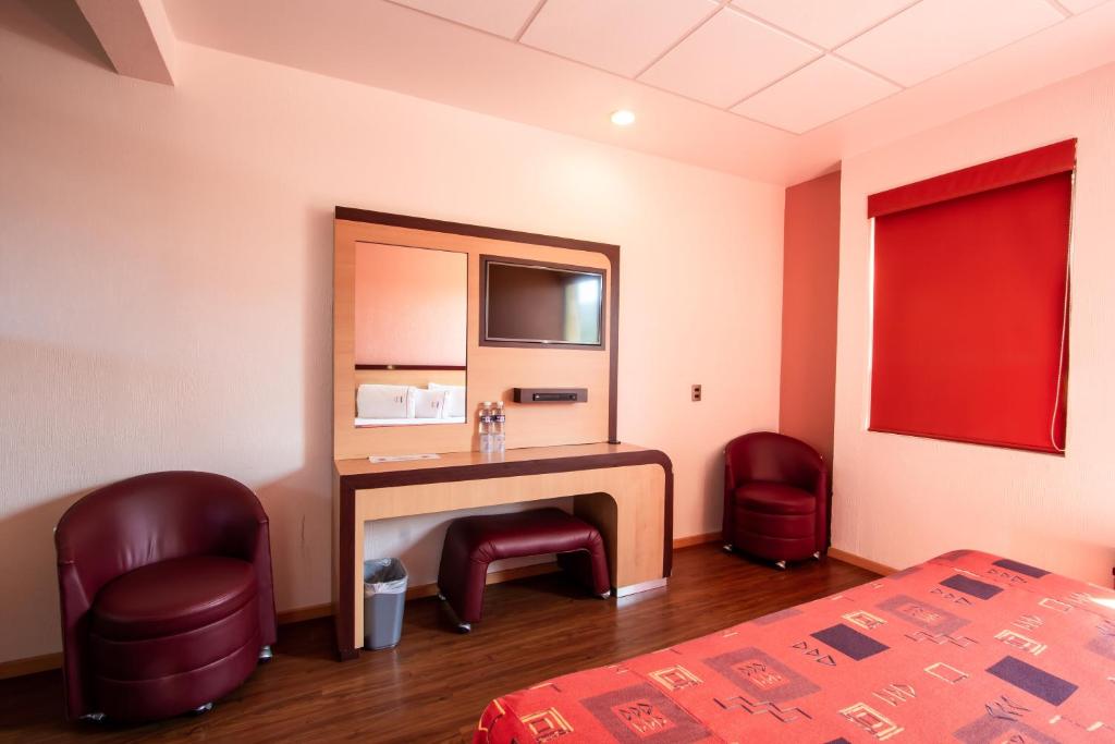Postel nebo postele na pokoji v ubytování HOTEL CASTELO