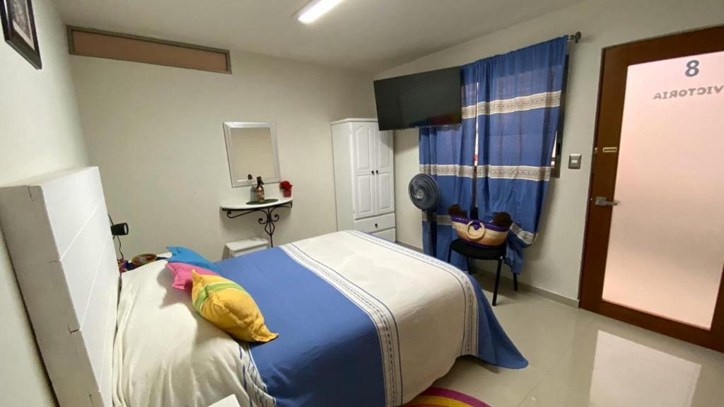 Postel nebo postele na pokoji v ubytování Casa Ana Celia
