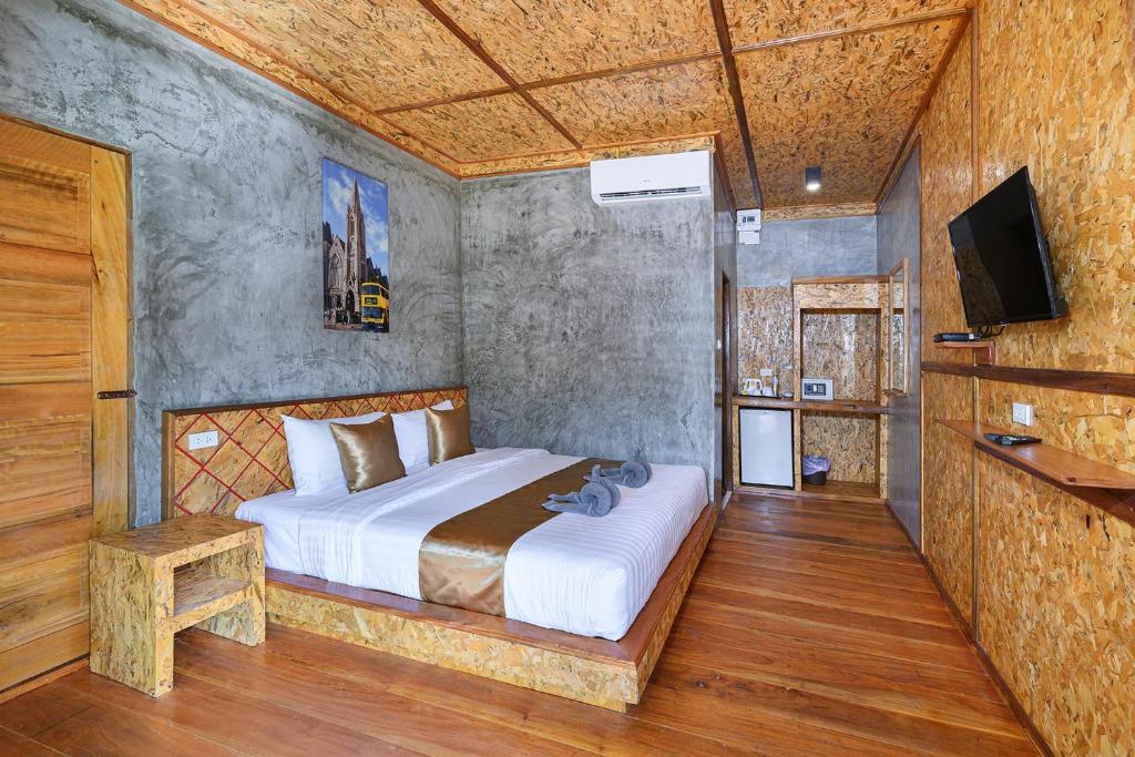 Postel nebo postele na pokoji v ubytování Baan Check In