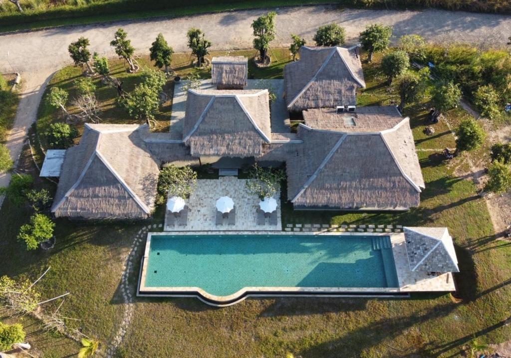 an aerial view of a house with a swimming pool at Hideaway in Chiang Mai