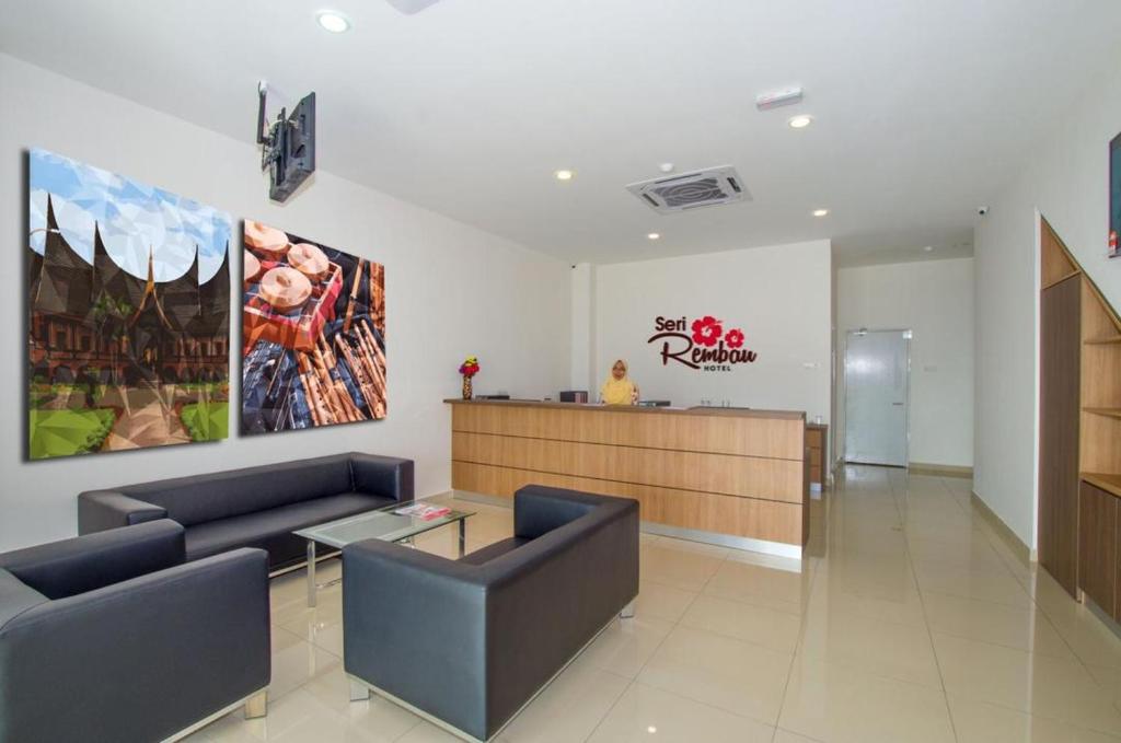 a waiting room with couches and a table in a building at Hotel Seri Rembau in Rembau