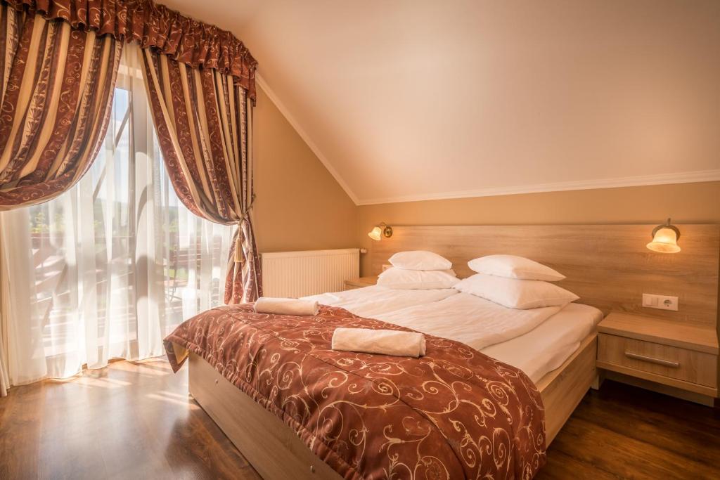 Postel nebo postele na pokoji v ubytování Németh Resort