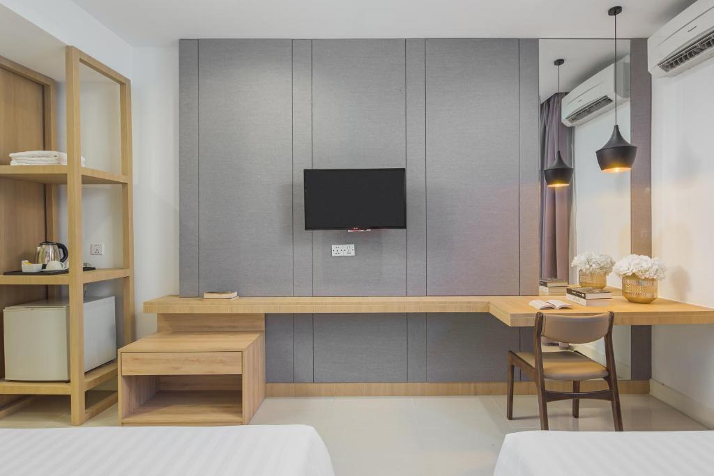 TV a/nebo společenská místnost v ubytování Altos Hotel