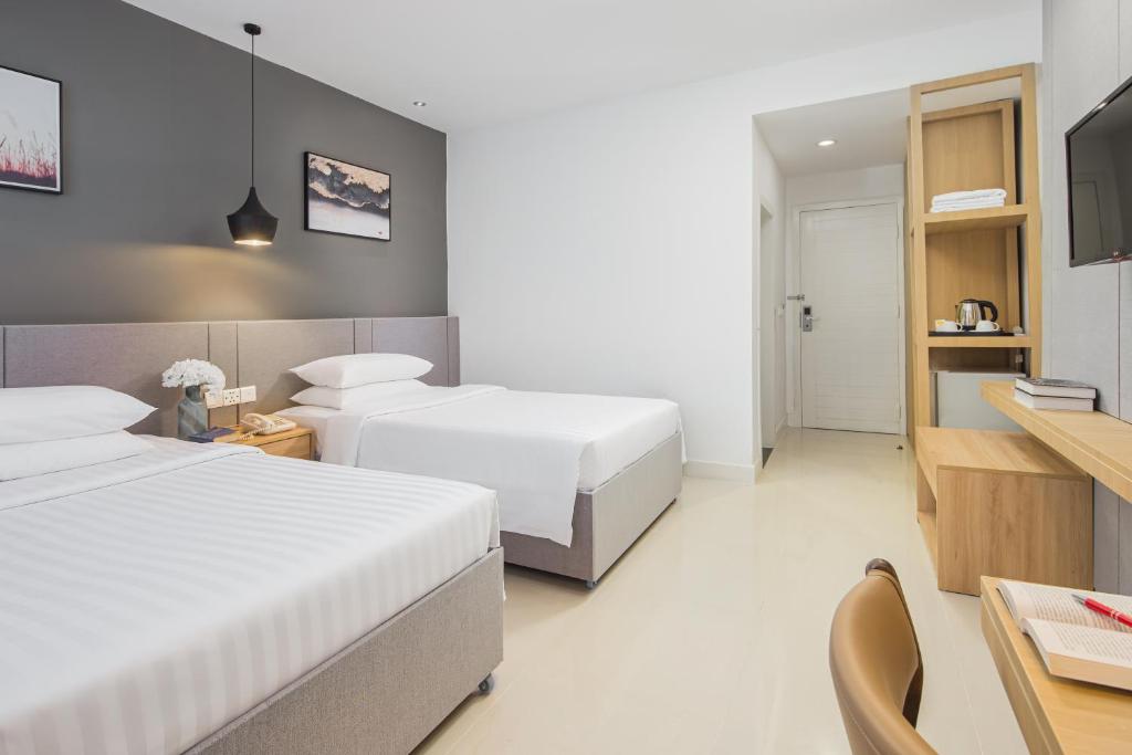 Postel nebo postele na pokoji v ubytování Altos Hotel