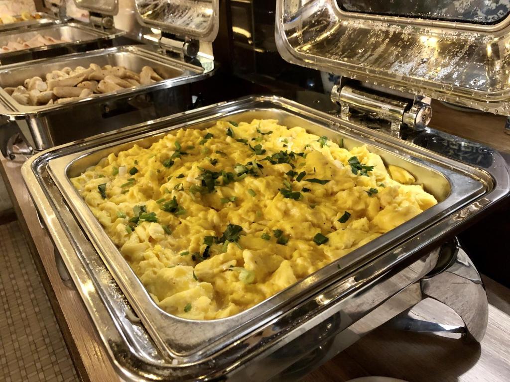 a casserole dish of food in a buffet at Kimberley Hotel Georgetown in George Town