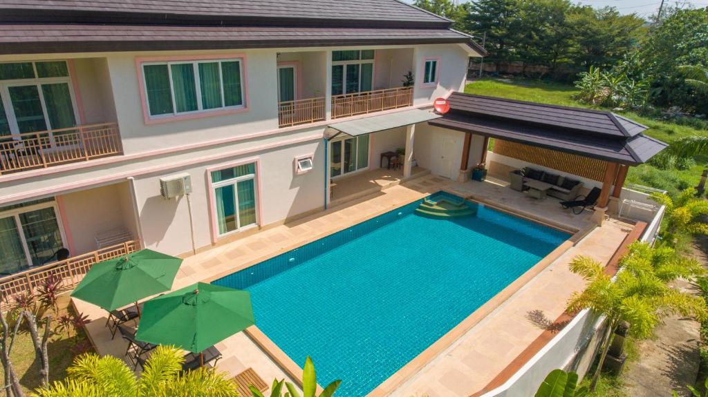 an aerial view of a house with a swimming pool at Phuket9 Residence in Chalong 