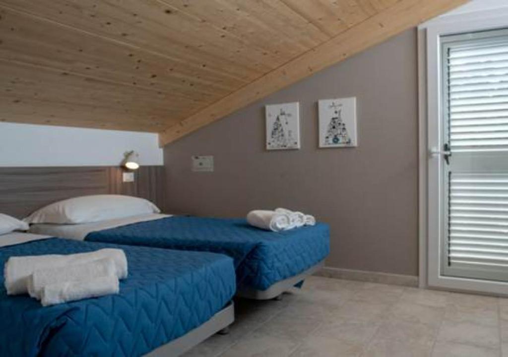 Postel nebo postele na pokoji v ubytování Hotel Consul Dipendenza la Plata con piscina