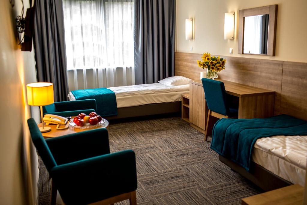 Posteľ alebo postele v izbe v ubytovaní Hotel Meeting