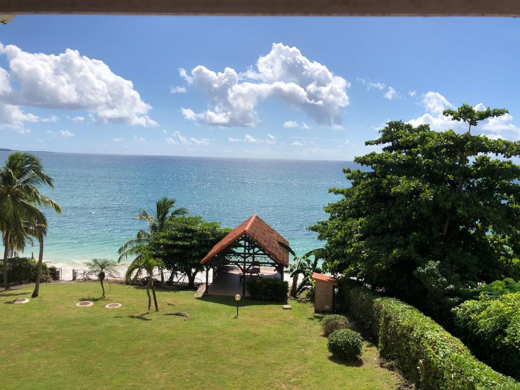 a view of the ocean from a resort at T2 les pieds dans l'eau, vue mer caraibes in Sainte-Luce