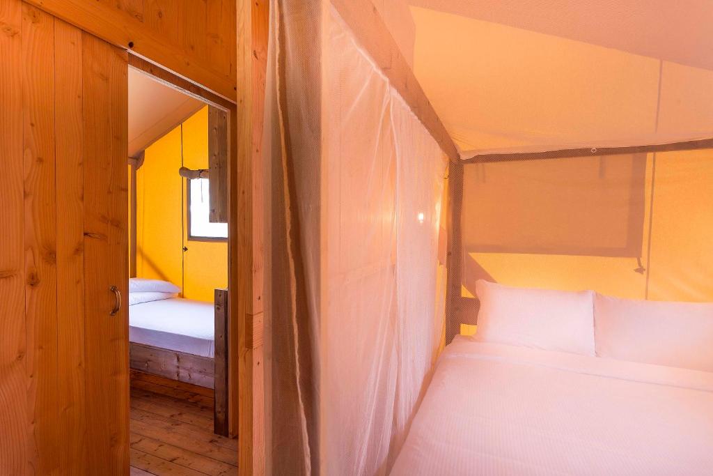 Кровать или кровати в номере Dune Agriturismo