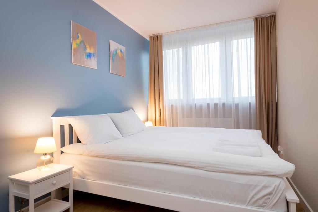 Ένα ή περισσότερα κρεβάτια σε δωμάτιο στο Ochota Homely Apartment