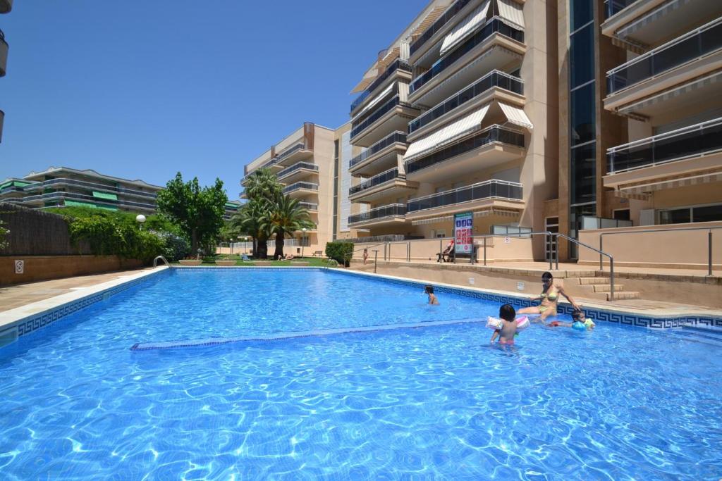 a group of people in a swimming pool in a building at WVP - Ventura Park Z in Salou