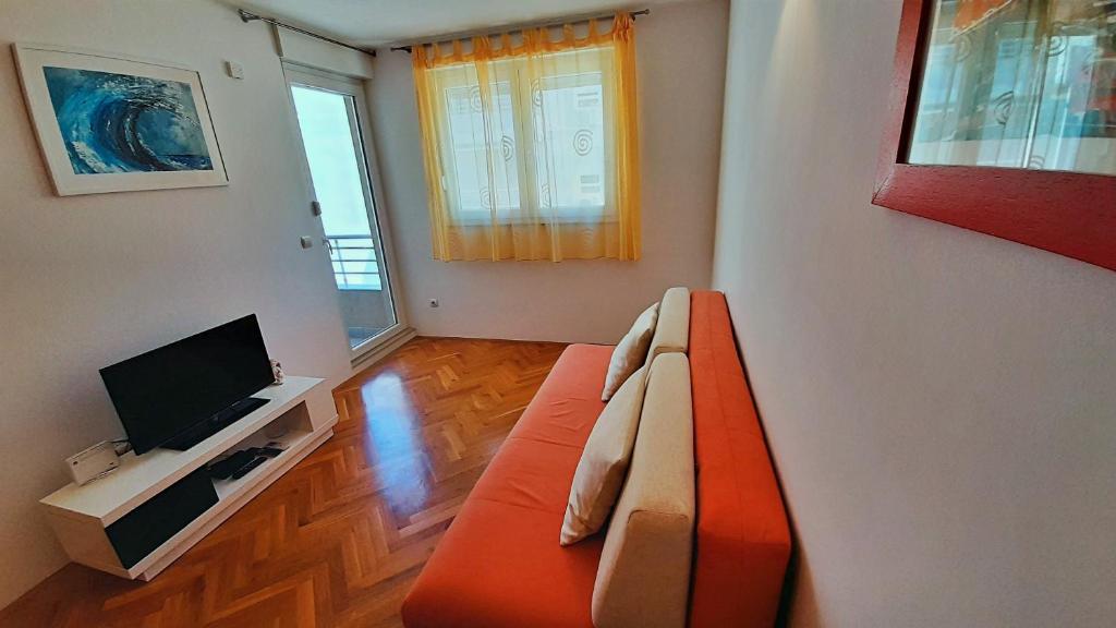 Televízia a/alebo spoločenská miestnosť v ubytovaní Apartment Jen