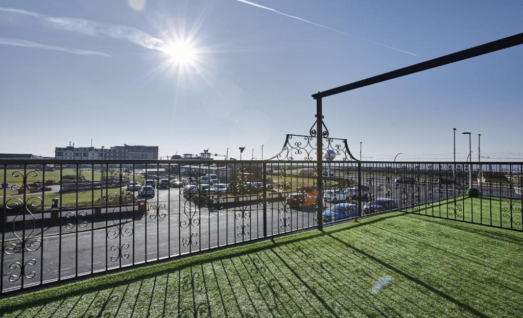 a balcony with a view of a parking lot at Fabrik Apartments - Harrowside by Blackpool Service Apartements in Blackpool