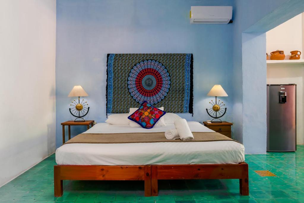 Postel nebo postele na pokoji v ubytování Casa del Solar Centro Cozumel - Wifi gratuito Fibra Óptica 200 Mbps
