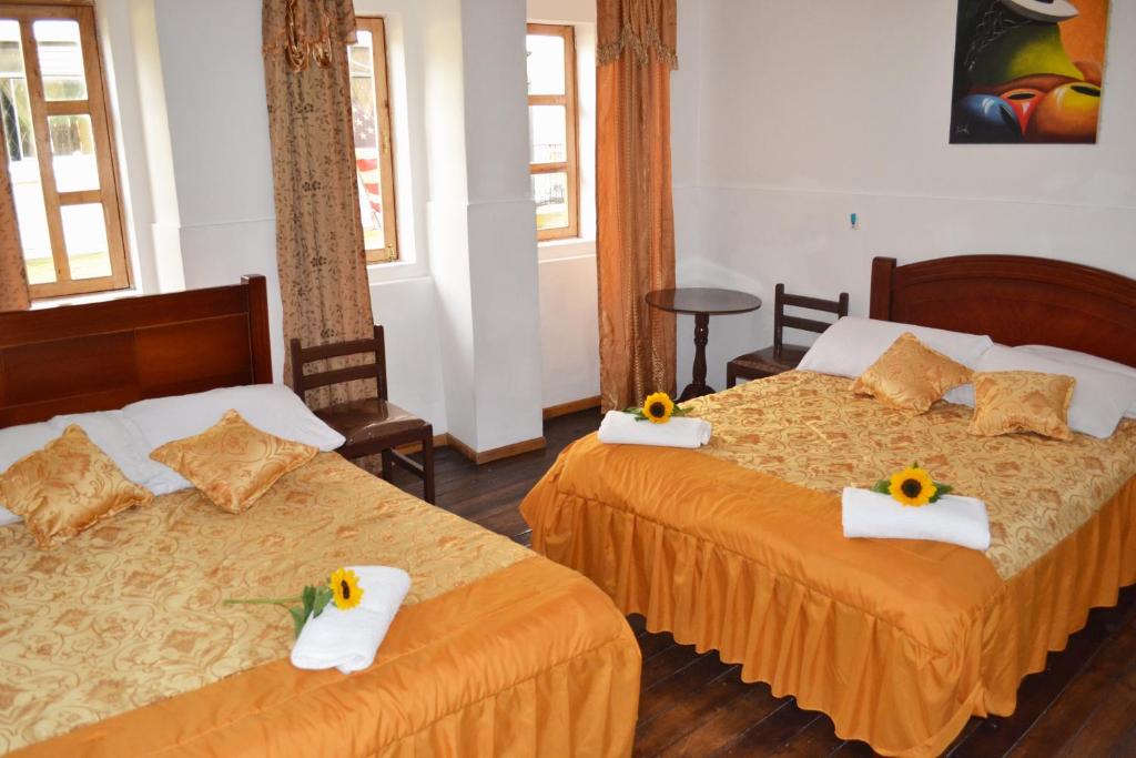 Postel nebo postele na pokoji v ubytování Colonial House Inn