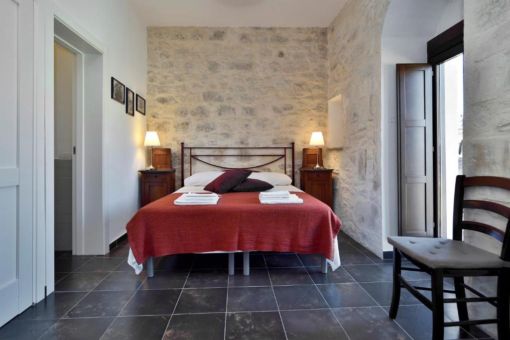 Postel nebo postele na pokoji v ubytování Le Luci su Ibla - Ospitalità con vista