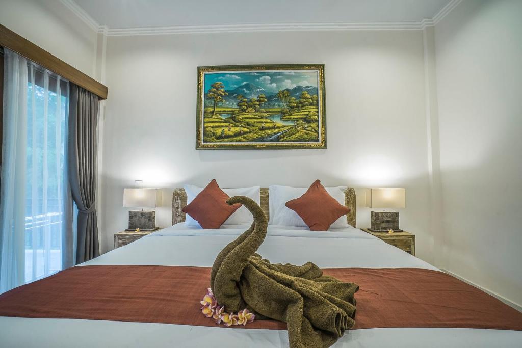 Postel nebo postele na pokoji v ubytování Adenia House Ubud