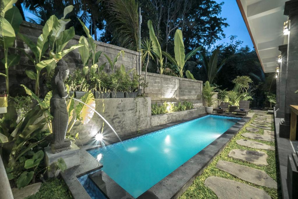 Bazén v ubytování Adenia House Ubud nebo v jeho okolí