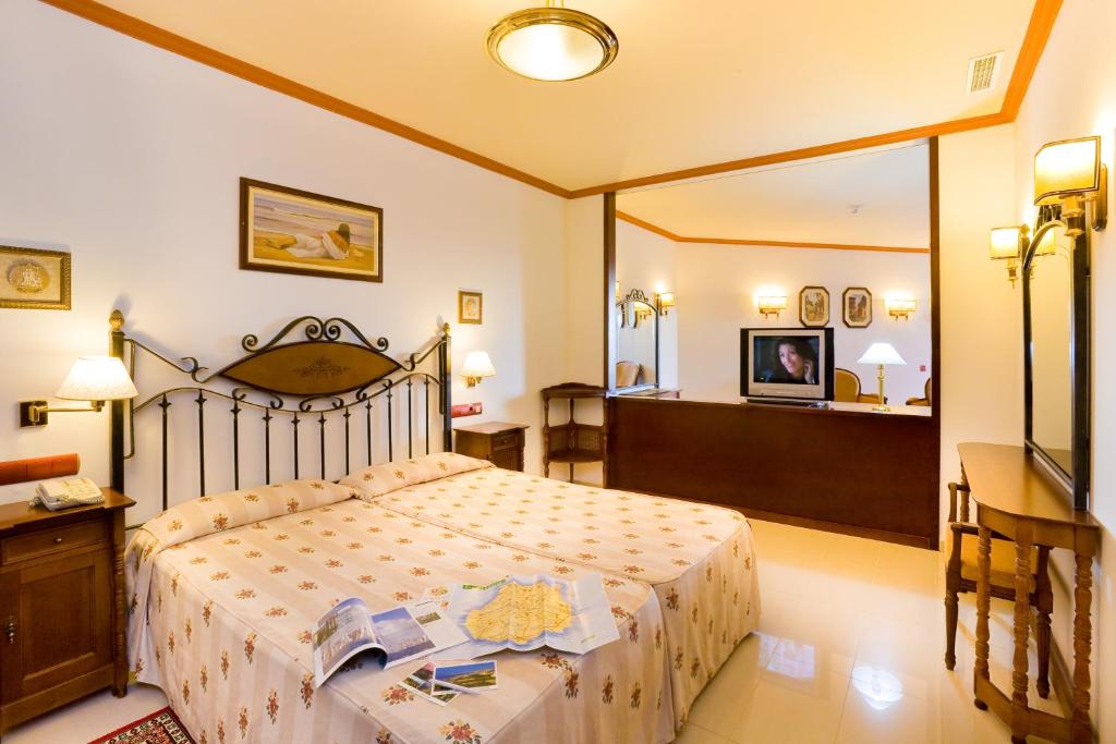 Postel nebo postele na pokoji v ubytování Hotel San Agustin Beach Club