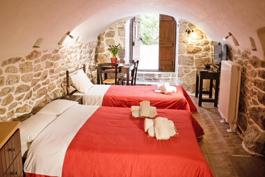 Posteľ alebo postele v izbe v ubytovaní Guesthouse Toxotis