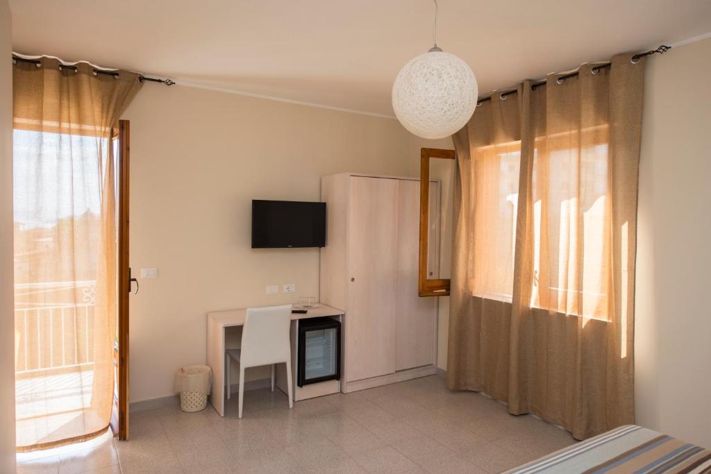 TV a/nebo společenská místnost v ubytování Donna Rosa Accommodation