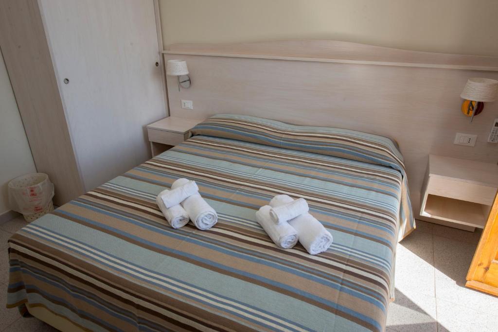 Postel nebo postele na pokoji v ubytování Donna Rosa Accommodation