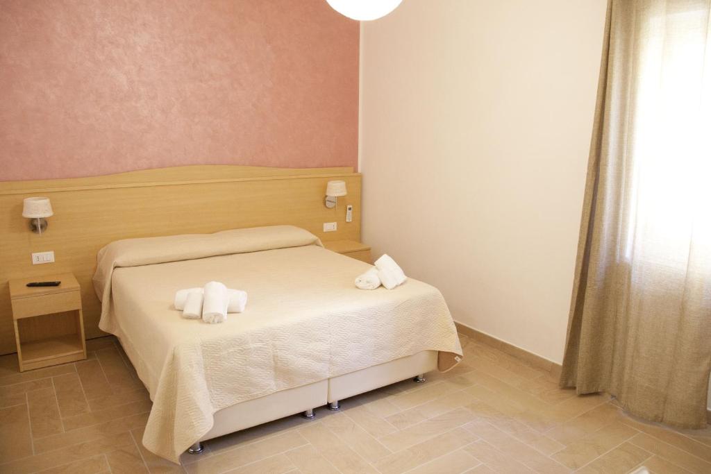 Postel nebo postele na pokoji v ubytování Donna Rosa Accommodation