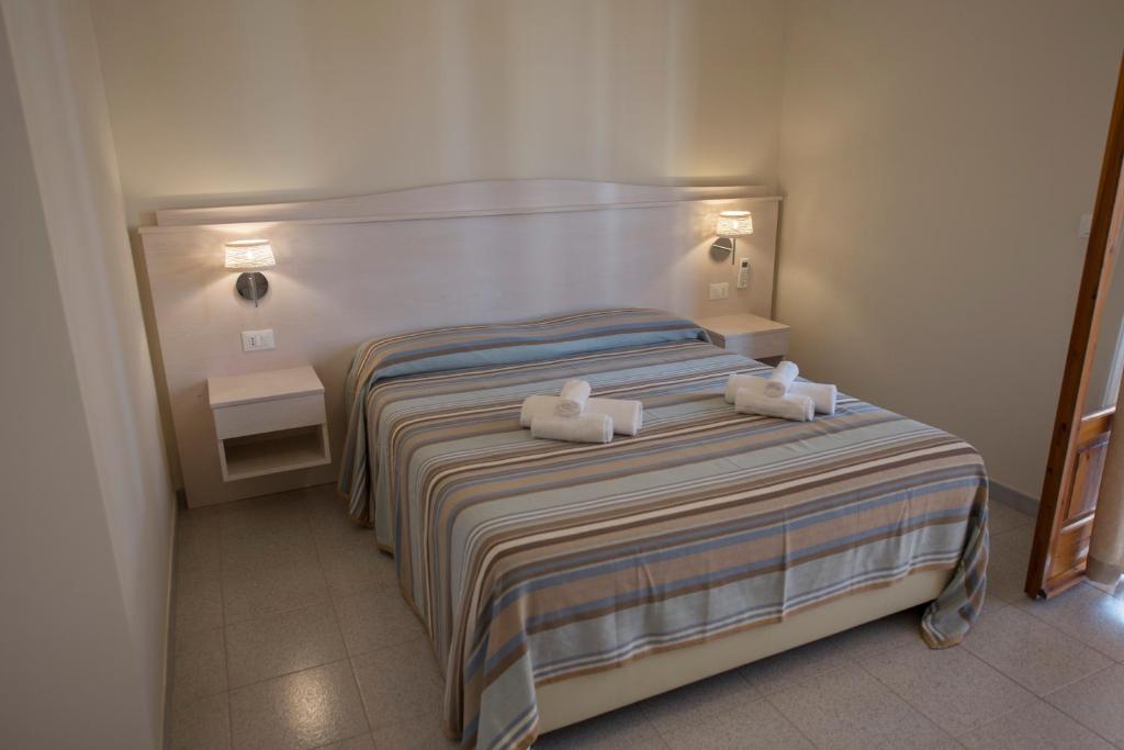 Postel nebo postele na pokoji v ubytování Donna Rosa Accommodation