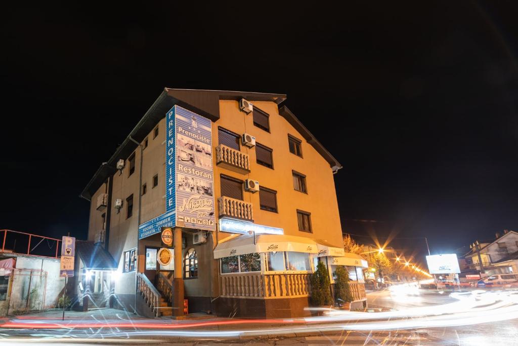 a building on the corner of a street at night at Vidikovac-Berane in Berane