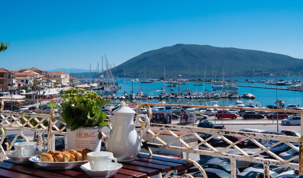 a table with a plate of food on top of a marina at LefkasLoft in Lefkada
