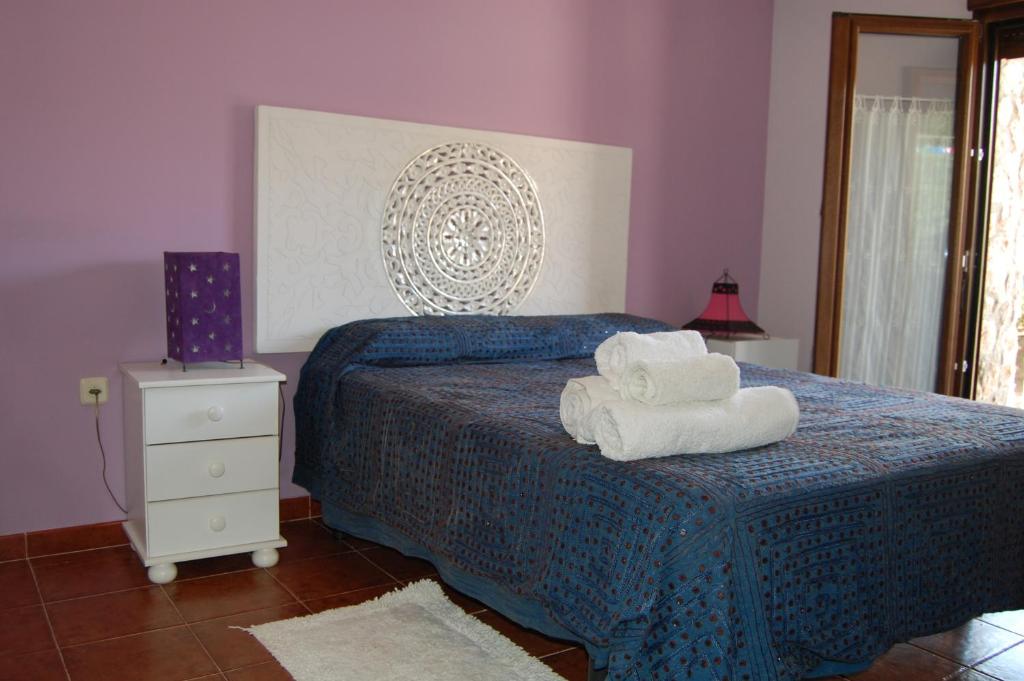 Posteľ alebo postele v izbe v ubytovaní Casa Cascabelera