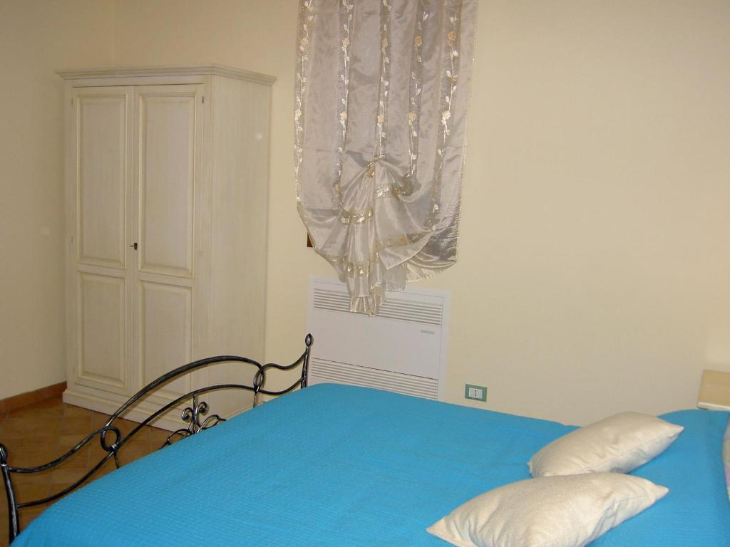 Postel nebo postele na pokoji v ubytování Agriturismo Monteortone