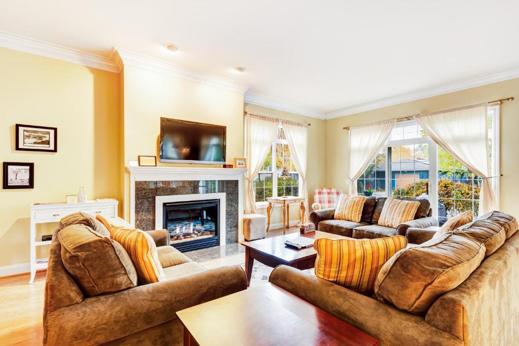 a living room with two couches and a fireplace at Beacon Court D in Douglas