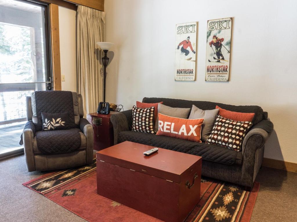 a living room with a couch and a chair at Charming Studio Condo in Truckee