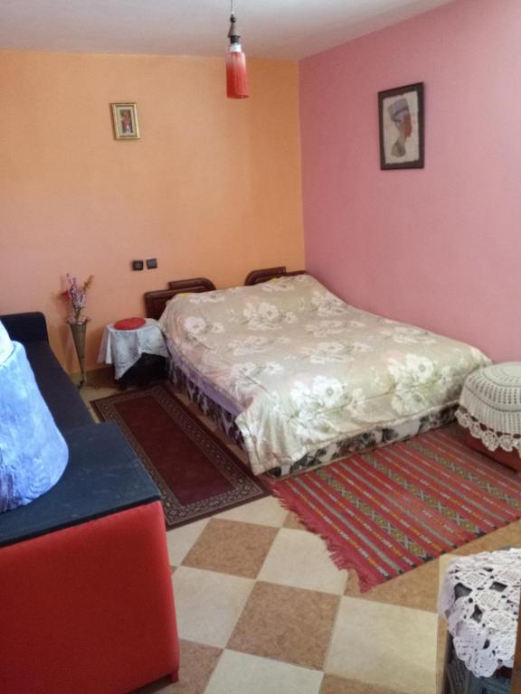 Postel nebo postele na pokoji v ubytování Naima's House