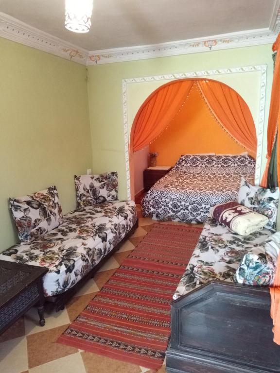 Postel nebo postele na pokoji v ubytování Naima's House