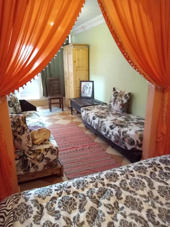 Postel nebo postele na pokoji v ubytování Naima's House