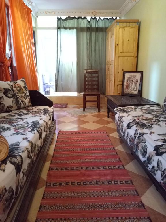 Postel nebo postele na pokoji v ubytování Naima's House