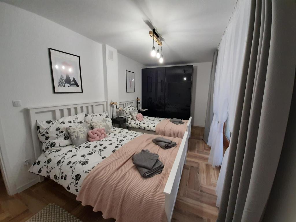 Posteľ alebo postele v izbe v ubytovaní Apartament Gaia