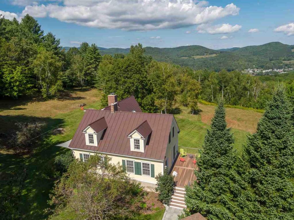 an aerial view of a white house with a brown roof at The Birch Grove in Woodstock