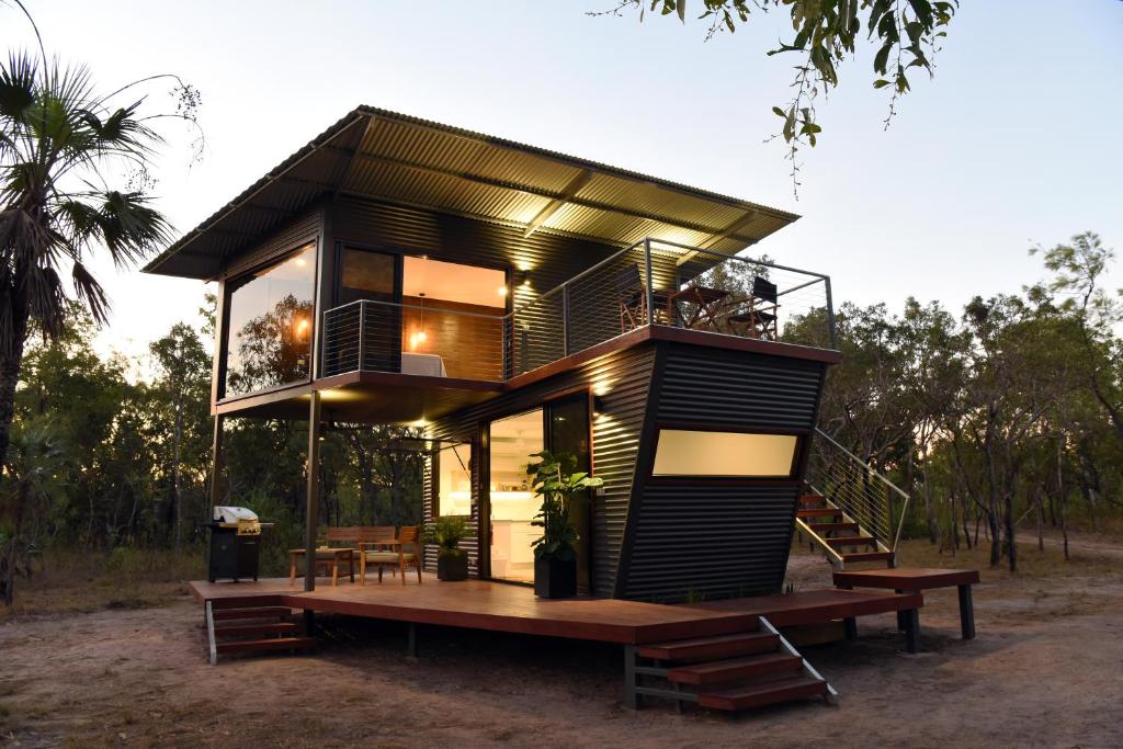 a modern house with a deck and a bench at Hideaway Litchfield in Rakula