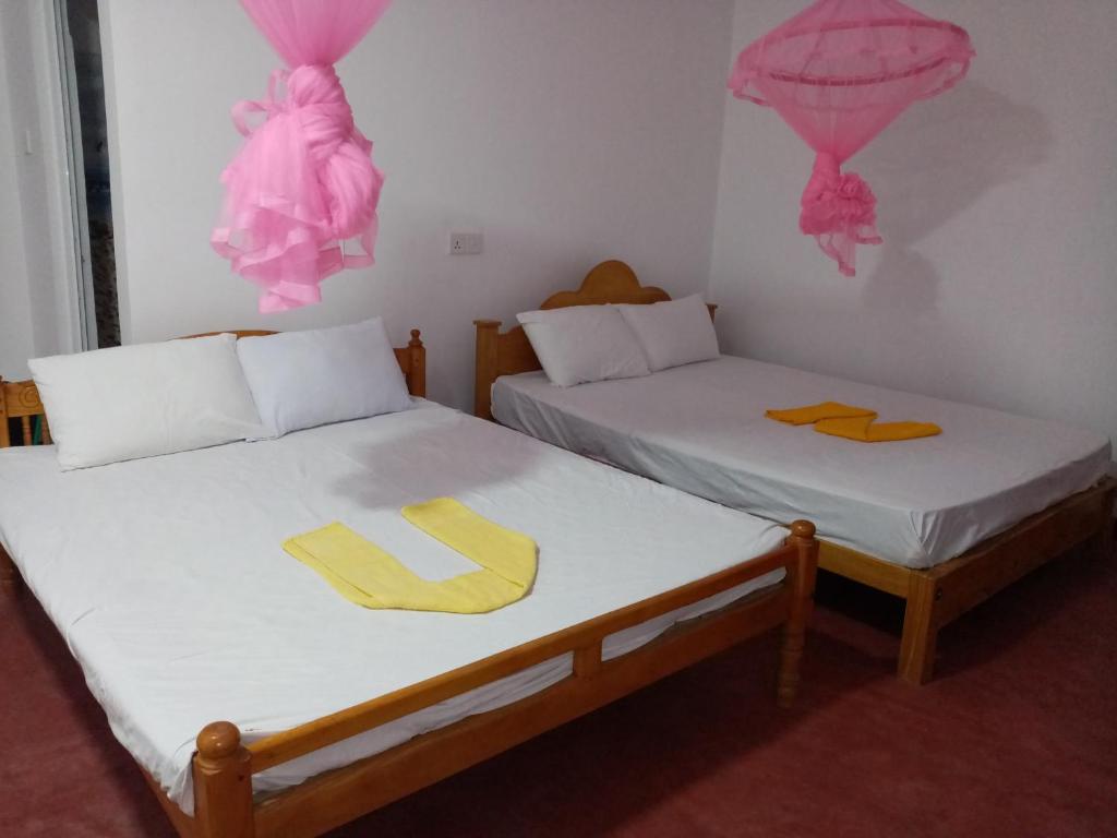 Postel nebo postele na pokoji v ubytování U new guest house