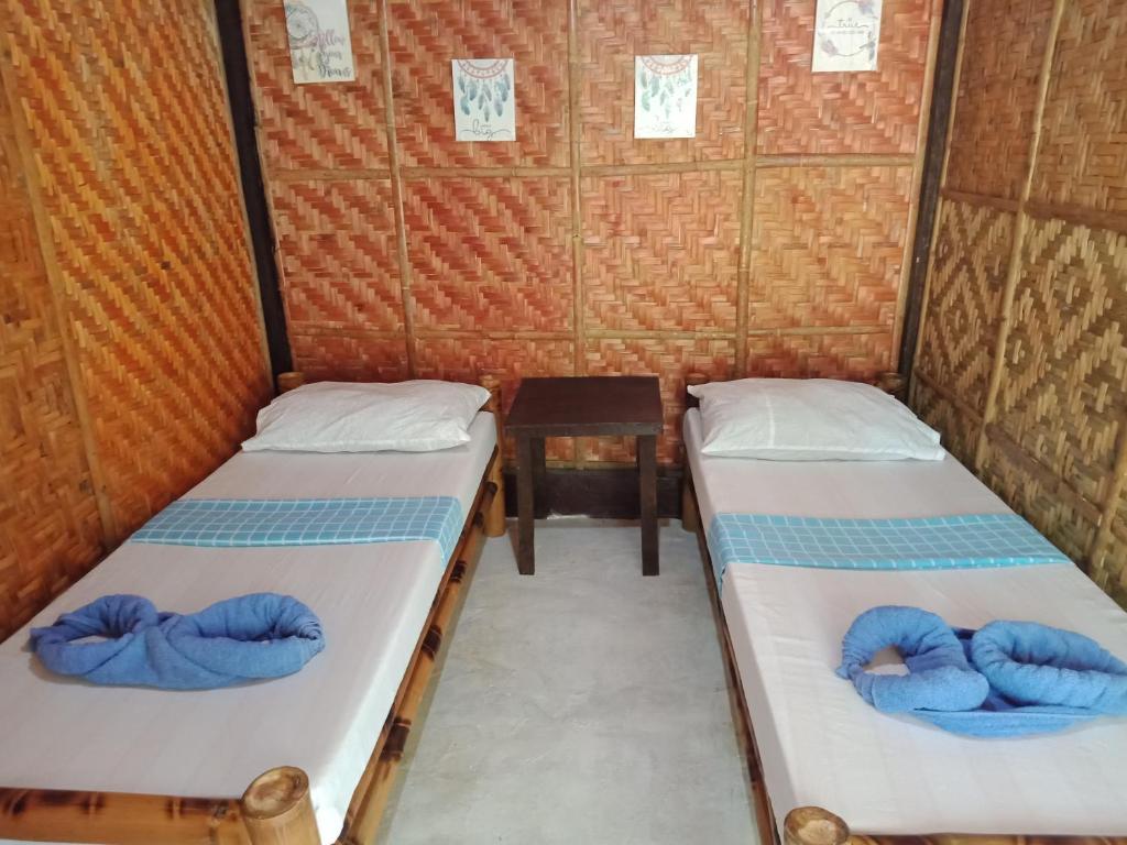 Ένα ή περισσότερα κρεβάτια σε δωμάτιο στο Walkerz Inn