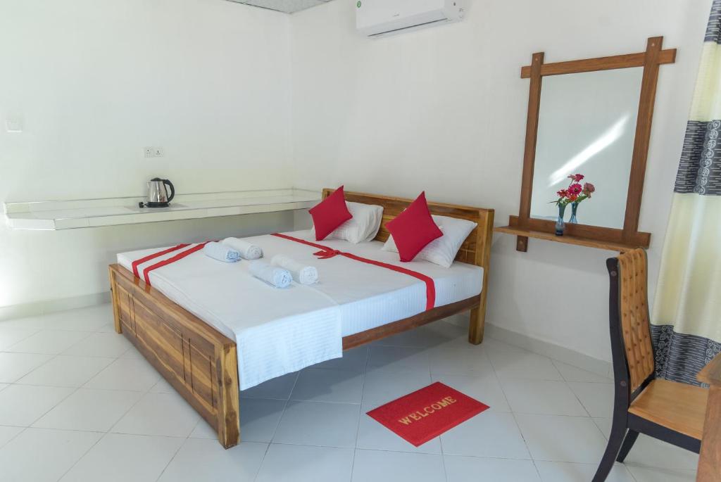 Postel nebo postele na pokoji v ubytování Autumn Home Stay