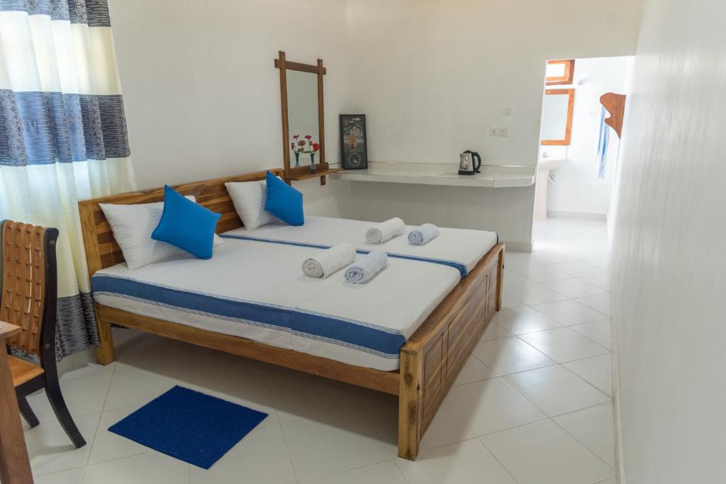 Postel nebo postele na pokoji v ubytování Autumn Home Stay