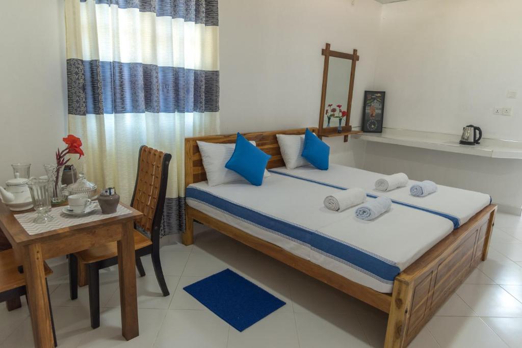 Postel nebo postele na pokoji v ubytování Autumn Home Stay