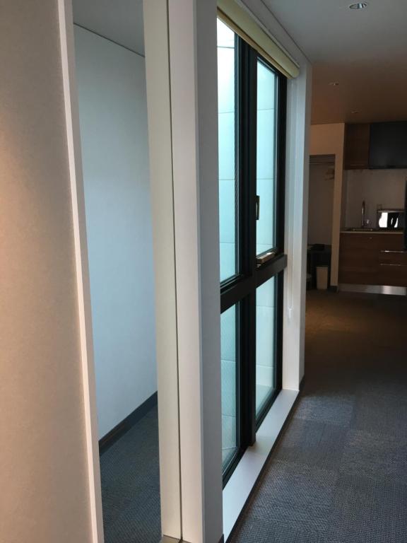 TV a/nebo společenská místnost v ubytování Hotel 草石庵