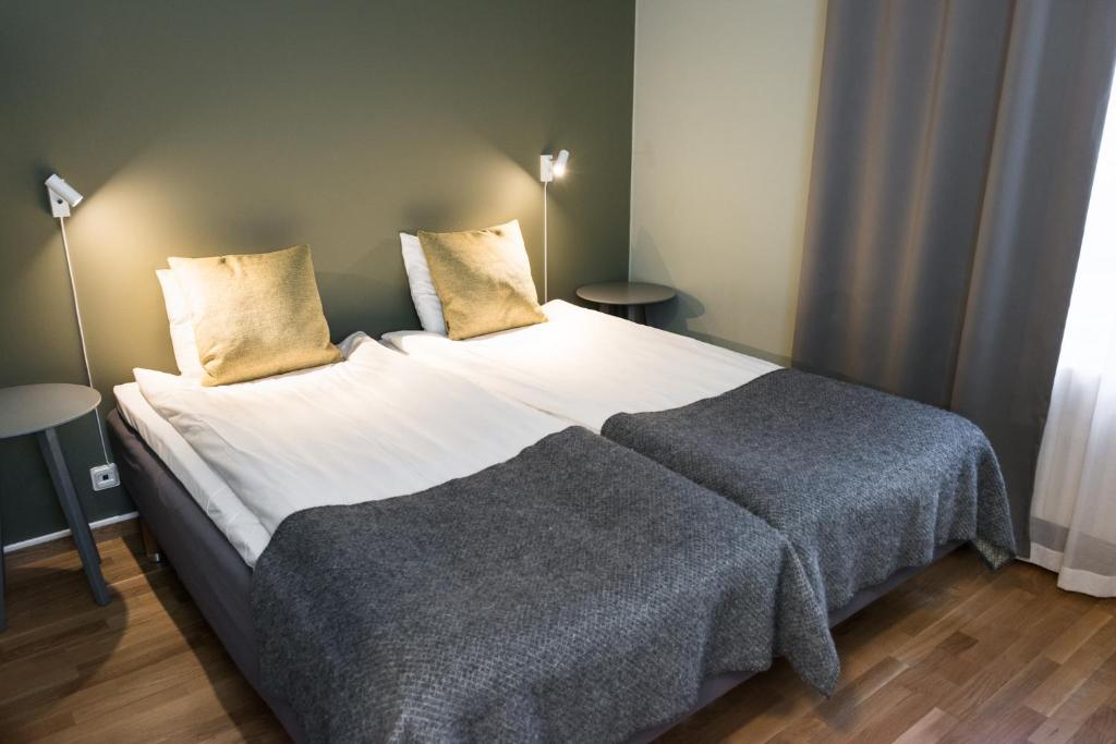 Ένα ή περισσότερα κρεβάτια σε δωμάτιο στο Nordens Ark Bed and Breakfast