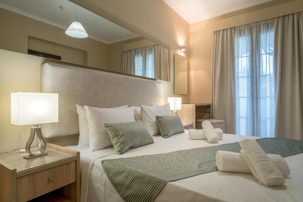 Postel nebo postele na pokoji v ubytování Golden Sun Hotel